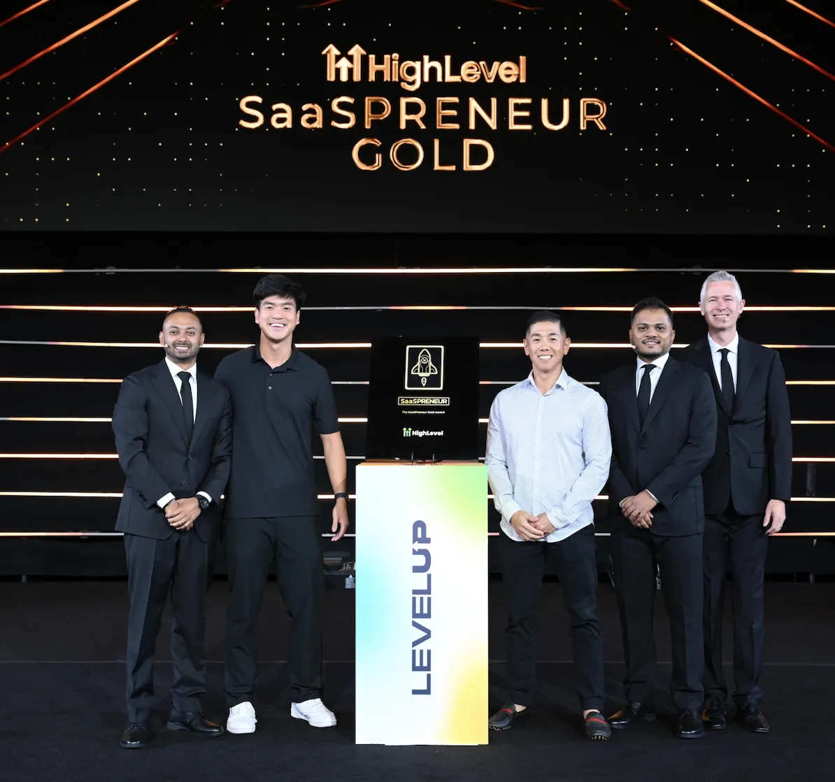 Paul on stage at HighLevel Level Up, receiving the SaaSpreneur Gold award